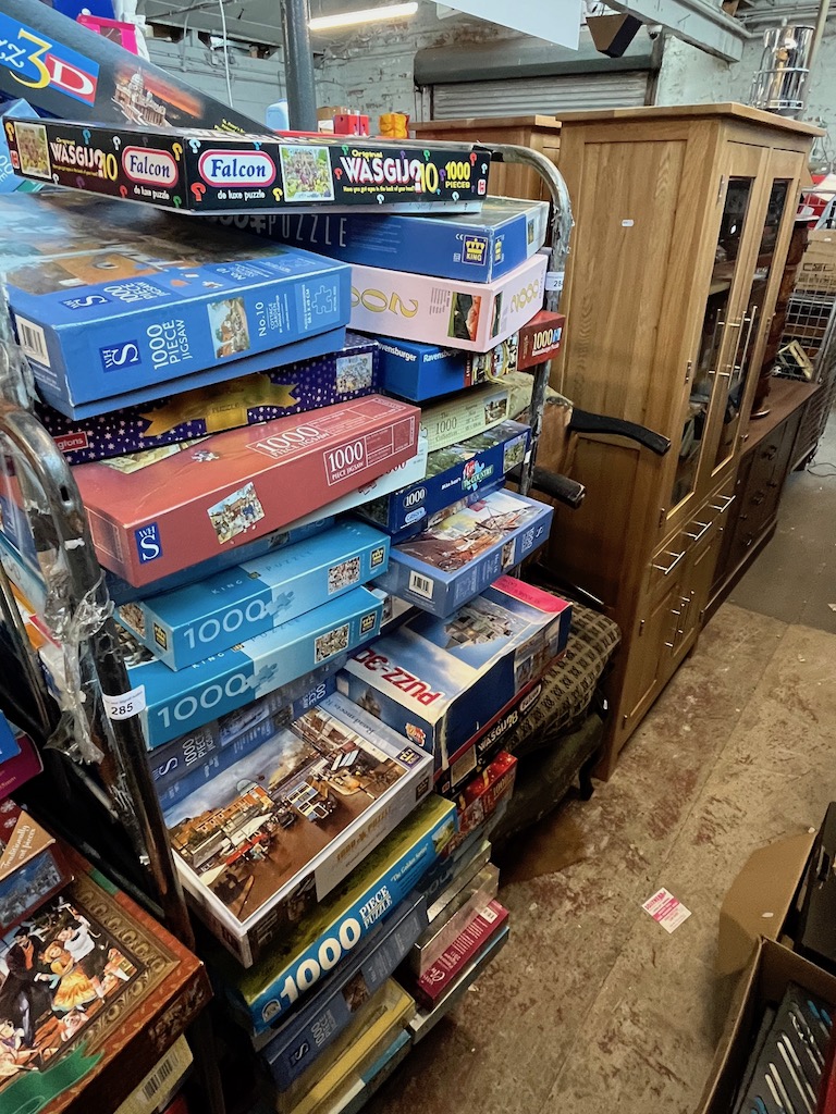 A large quantity of jigsaws and games.