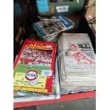 A collection of football and rugby league programmes, mainly Wigan FC