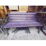 A cast metal garden bench and a pair of bench ends.