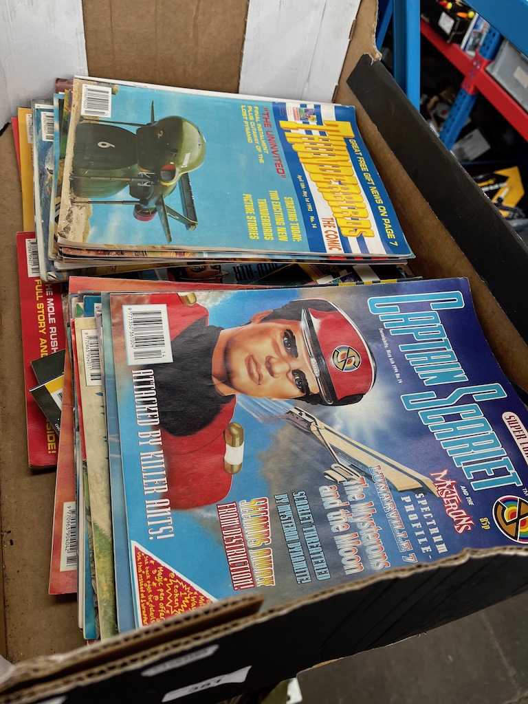 A box of Thunderbirds and Captain Scarlet comics.