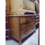 An early 20th century mahogany chest of drawers with bakelite handles together with matching