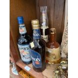 Five bottles of Spirits including Pusser's Rum, Lambs Navy Rum, Bells Whisky in a decanter,