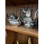 A four piece silver plated tea set by Walker & Hall.