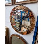 A vintage 1930s Atsonea Art Deco 24" round mirror with peach bevelled glass and silver/gilt gesso