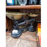 A set of Fibasco kitchen scales with brass bell weights.