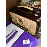 A vintage brown and cream bakelite cased 'Ultra' radio.