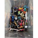 A box of die cast model vehicles, mainly Hotwheels.