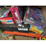 A box of toys to include track racing game, Flying Fighters, helicopter, Robotech, etc.