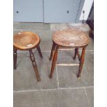 A Victorian mahogany stool with metal cross-stretcher together with another Victorian stool.