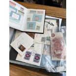 A collection of first day covers including silver jubilee together with a book of world stamps and a
