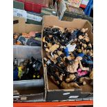 Two boxes of wrestling figures and Action men.
