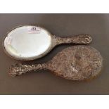 A hallmarked silver brush and mirror.
