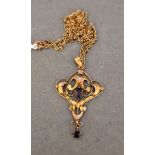 An Edwardian purple stone set pendant marked '9c', length 51mm, on gold plated chain length 48cm,