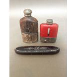 A silver plated golf related flask together with a pewter and leather flask and an Oriental ebonised