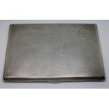 A hallmarked silver cigarette case, 12.5cm x 8.5cm, wt. 6ozt.