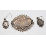 A pair of Victorian hallmarked silver earring and similar brooch unmarked.