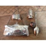 A selection of hallmarked silver items including a purse, a napkin ring, a spoon, a sugar sifter top
