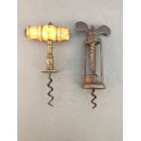 A 19th century brass Farrow & Jackson style corkscrew, heavy brass twin pillar mechanical