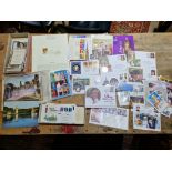 A box of royal related stamps and vintage postcards
