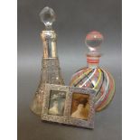 A silver collared perfume bottle together with a Venetian glass perfume bottle and a small silver