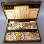 A box of vintage brooches to include dry flowers, tapestry examples, various settings, etc.