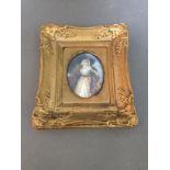 A 19th century miniature portrait in gilt frame, signed Evelin.