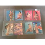 A collection of vintage Japanese lenticular prints of nude ladies.