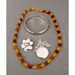 Hallmarked silver jewellery comprising bangle, flower brooch and pendant on chain together with an
