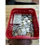 A tub of assorted GB and world coins to include some silver