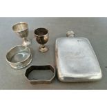 A selection of hallmarked silver items to include a napkin ring and two small trophies / cups