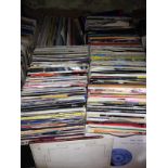 A box of approx. 200 45s, various dates and genres.