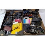 2 boxes of cameras and accessories to include Cannon Eos and Nikon etc.