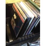 A box of approx. 59 LP records and some singles, circa 1970s and 1980s.