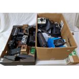 Two boxes of cameras and accessories to include 4 x Sony handycam, Olympus trip 35, Polaroid 1000,