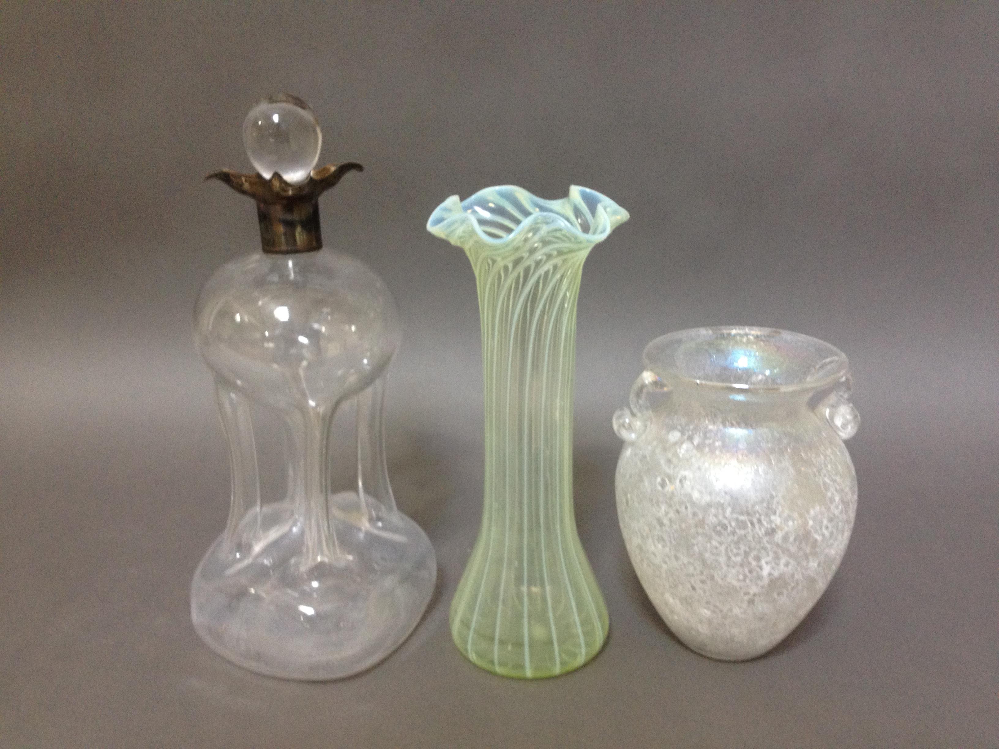 Three pieces of antique glass comprising a hallmarked silver mounted decanter, a Whitefriars twist