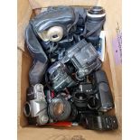 A box of cameras and camera equipment including lenses etc.