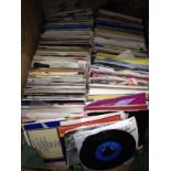 A box of approx. 200 45s, various dates and genres.