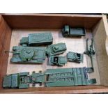 A box of military Dinky diecast vehicles