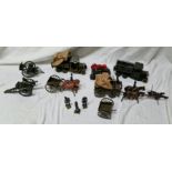 A box of Britains military diecast vehicles and figures.