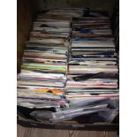 A box of approx. 200 45s, various dates and genres.