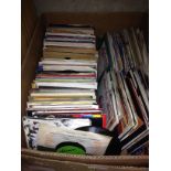 A box of approx. 200 45s, various dates and genres.