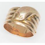 A 9ct gold ring formed as a coiled snake, hallmarked 9ct gold, sponsor mark indistinct, Birmingham