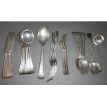 A set of silver flatware comprising six large forks, five fish forks, two serving spoons, five