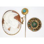 Antique jewellery comprising a shell cameo brooch marked '9ct', a Etruscan Revival brooch set with