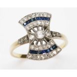 A 1930s Art Deco diamond and sapphire bow shaped cluster ring, the millegrain set cluster