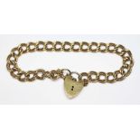 A hallmarked 9ct gold bracelet with heart shaped padlock clasp, length 15.5cm, wt. 11.9g.