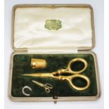 A 9ct gold thimble and scissor set, the thimble hallmarked, sponsor's mark 'J.S', Birmingham 1920,
