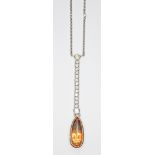 A diamond and orange topaz negligee necklace, the bezel mounted pear cut topaz weighing approx. 5.