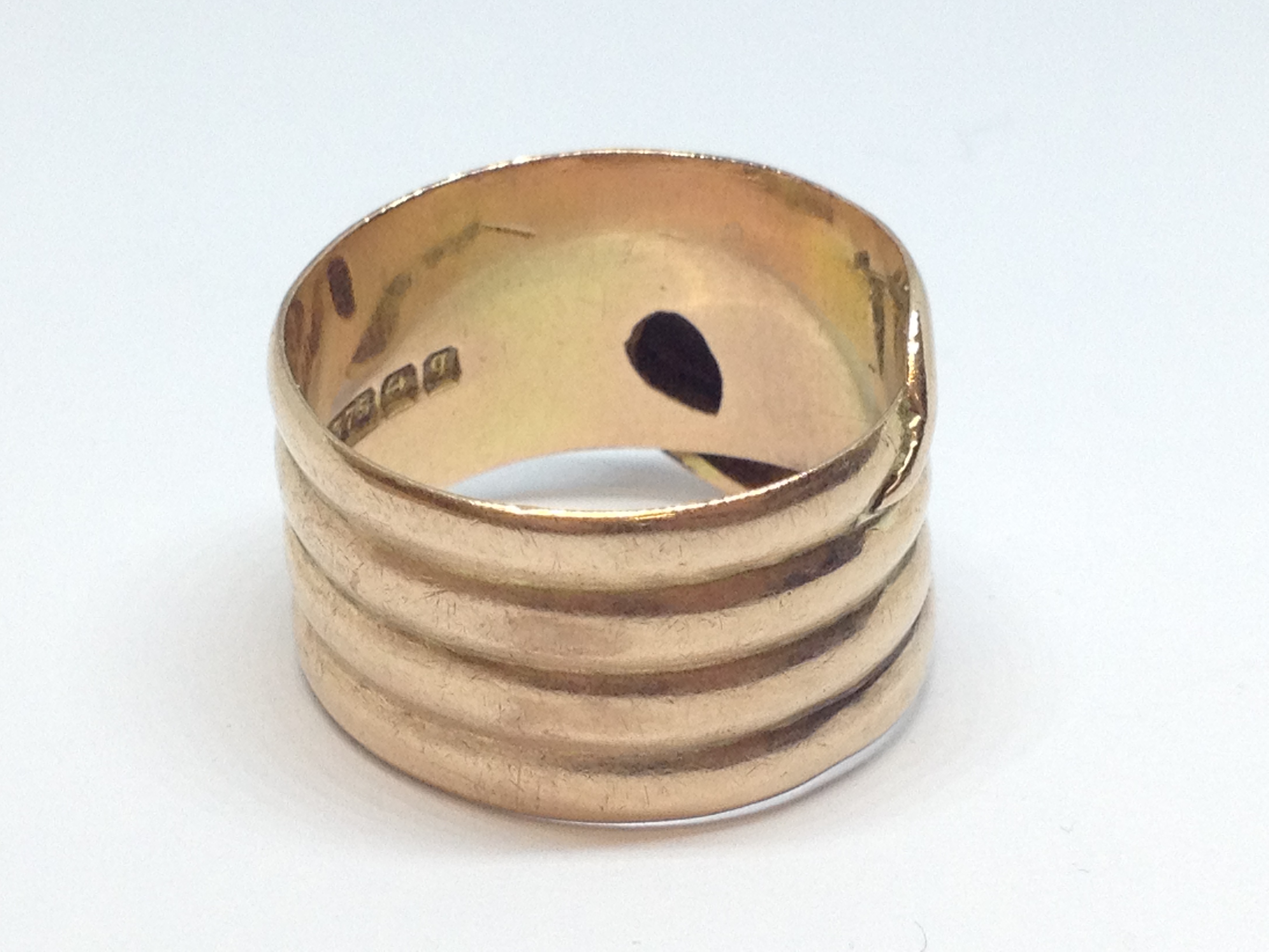 A 9ct gold ring formed as a coiled snake, hallmarked 9ct gold, sponsor mark indistinct, Birmingham - Image 4 of 4