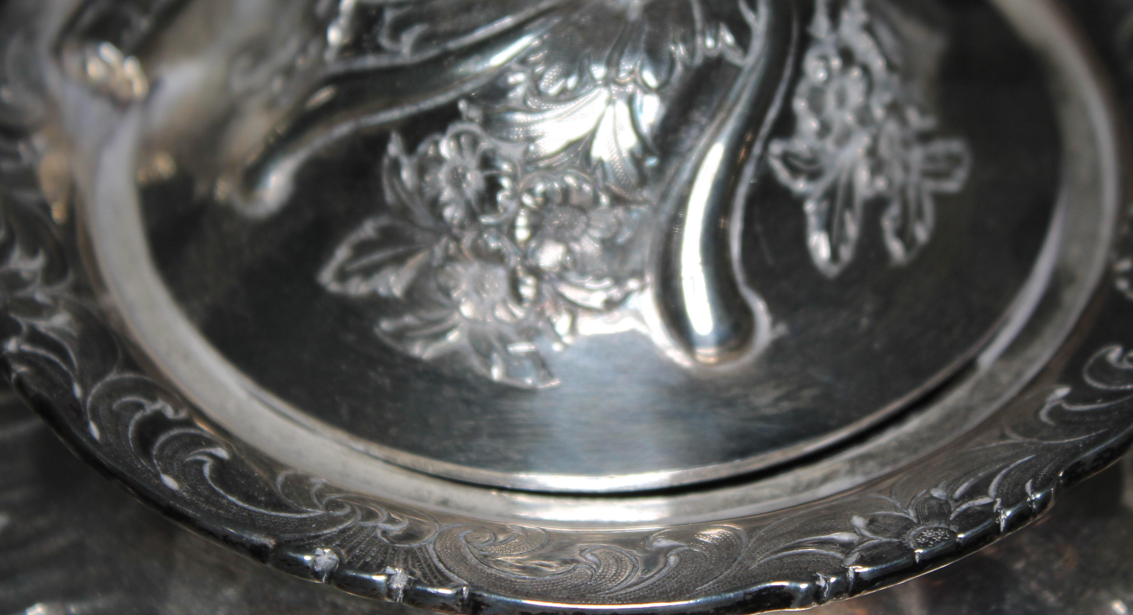 A William IV Scottish silver tea set, repousse decoration depicting floral bouquets and scrolls, - Image 2 of 4